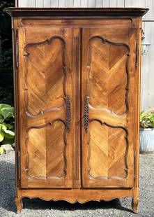Fine French Provincial Walnut Armoire: with inset herringbone paneled doors, interior now fitted as TV cabinet. 88" high, 60 1/8" wide, 24" deep. Expected age and use wear.