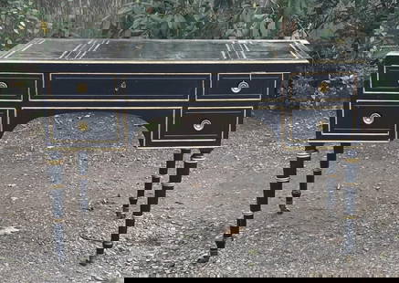 Baker Regency Style Gilt/Ebonized Writing Desk: rectangular writing desk with three section tooled leather top, long center drawer flanked by two side drawers, faux drawers verso, in bamboo design with gilded highlights, two pull out writing slides