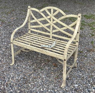 Regency Style Child's Wrought Iron Garden Bench: in old ivory colored paint, strapwork design. 21" high, 22" wide, 13" deep. Expected wear, oxidation.