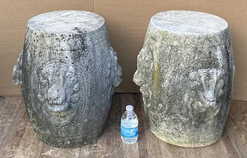 Near Pair Chinese Carved Solid Marble Garden Seats: solid marble with raised lion mask decoration, slightly differing on each. 17 1/2" high, 17 1/2" diameter. Wear and losses from exposure to elements. These items are exceptionally heavy, will require