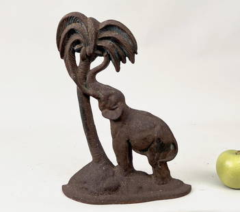 Rare Cast Iron Elephant Palm Tree Doorstop: 14" high, 10 1/2" wide, 3" deep. Oxidation, traces of earlier paint to surface.