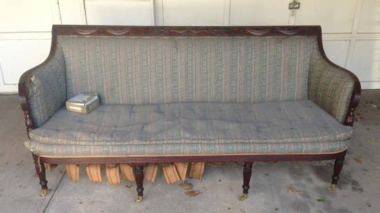 NY Sheraton Carved Mahogany Curved Arm Sofa: with cornucopia and drapery swag carved crest panels, reeded arms and bulbous turned acanthus carved posts, horseshoe shaped seat with reeded rail, rope carved and reeded legs and brass cup casters. S