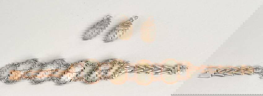 Egyptian Revival Gold Scarab Bracelet: carved stone scarabs set in lotus flower design bracelet; together with two pendants, or possible earrings. Bracelet: 7 1/2" long, 7/8" wide. Gross weight of bracelet: 16.7 DWT. *No credit card paymen