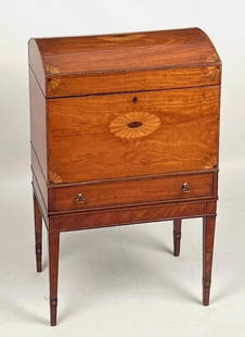 George III Inlaid Satinwood Cellarette: with domed lift top, one drawer, set on a tapered leg base and inlaid overall with paterae, quarter fans and complex string inlays. Late 18th century. 29 /4" high, 18 1/2" wide, 12 1/4" deep. Expected