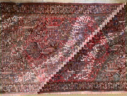 Persian Heriz Carpet: room size rug, 20th century. 9' 2" wide,12' 2" long. Wear, fading, some bare spots from rot as shown, water damage. All rugs sold as is.