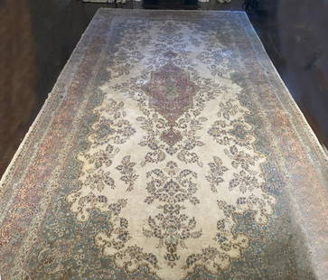 Palace Size Persian Kerman Rug: with ivory ground and central floral medallion, various border and field floral designs. 12' 10" wide, 27' 6" long. Some indentations from furniture as shown, very slight discoloration from use. All r