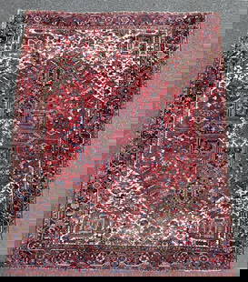 Persian Heriz Carpet: circa 1940's. 9' 9" wide, 12' 10" long. Some areas of wear, fading, please see photos. All rugs sold as is.