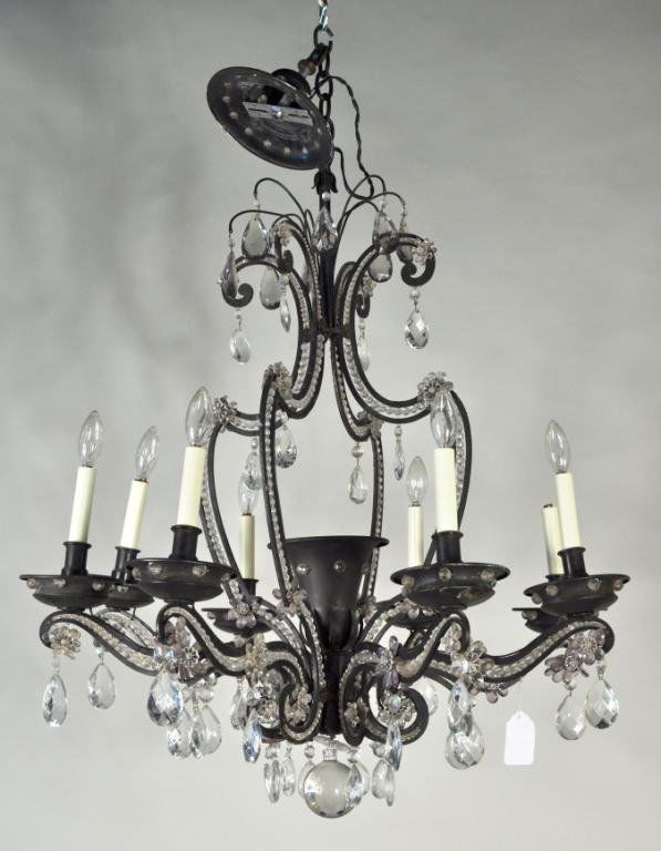 Maison Bagues French Crystal & Iron Chandelier: Maison Bagues French crystal wrought iron 8 light chandelier, the scrolling arms and frame embellished with glass beads, crystal flower heads and faceted pendants, 20th century. 30" high, 30" wide.