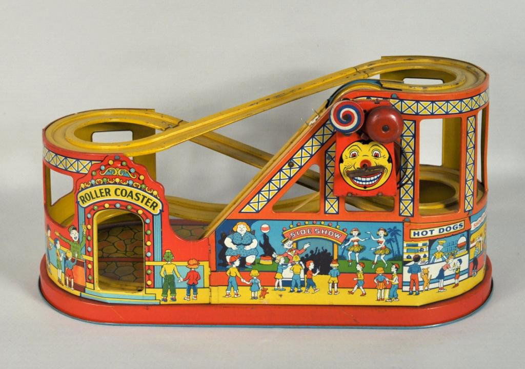 J. Chein Tin Roller Coaster & Two Cars: Vintage J. Chein tin roller coaster toy together with two apparently original cars, one lacking front wheels. 9 3/4" high, 19" wide, 9" deep.