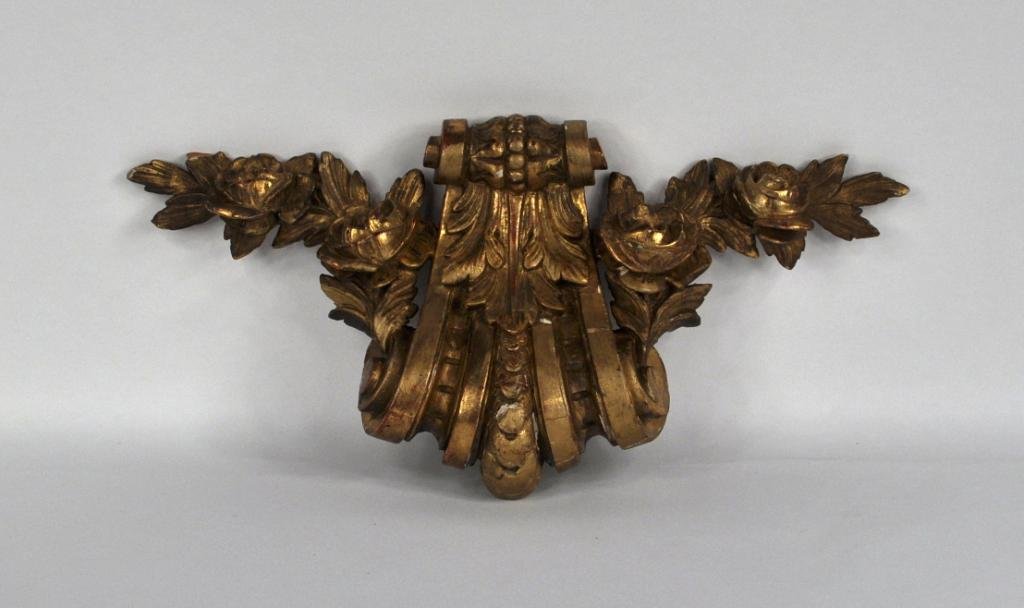 Gilt Decorative Fragment: Antique carved decorative element, scrolled form issuing flowers, losses and cracking. 7 3/4" high, 17" wide, 3" deep.