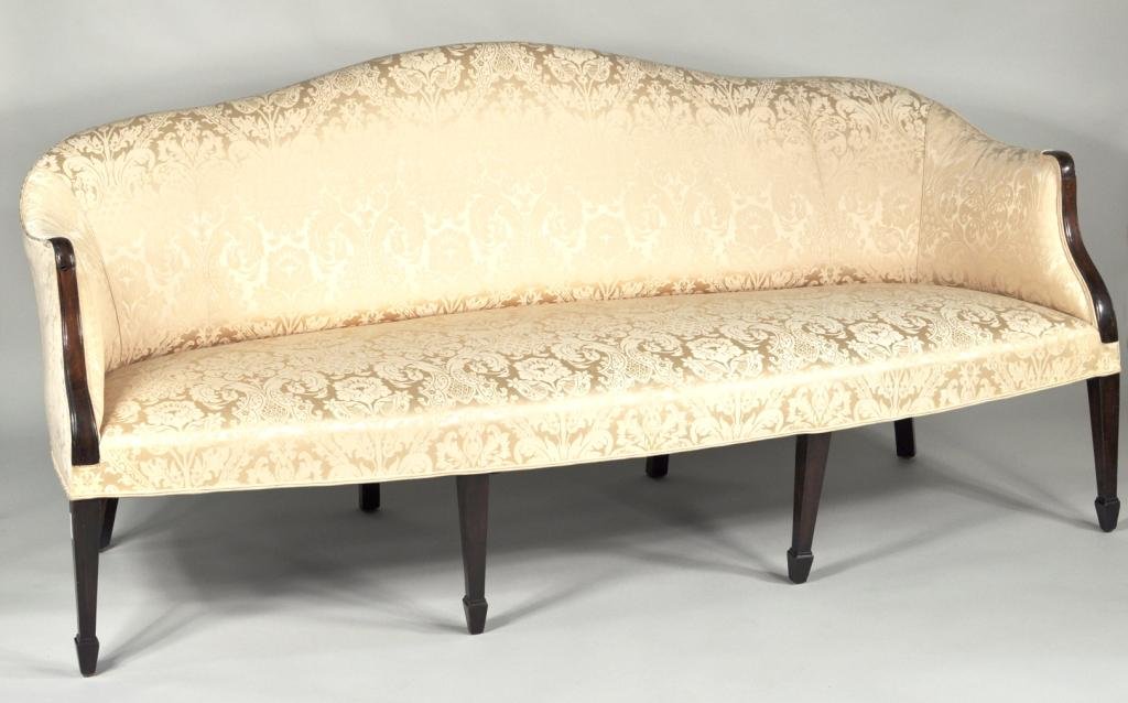 Hepplewhite Style Cabriole Form Mahogany Sofa: Hepplewhite style cabriole form mahogany sofa, with serpentine back and arms, upholstered in pale yellow damask raised on tapering legs ending in spade feet. Loose center right front leg. 36 1/2" high