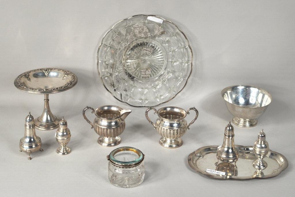 Group Eleven Assorted Sterling Silver Items: Group of eleven sterling and other table wares, including two pairs of shakers, biscuit or sweets stand, and glass circular cake platter. 32.245 ozt. weighable silver. Largest: 11" diameter; smallest: