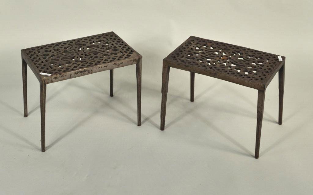 Two Similar Brass Fireplace Trivets: Two similar brass fireplace trivets, with elaborate pierced tops. 11 3/4" high, 16 1/2" wide, 11" deep.