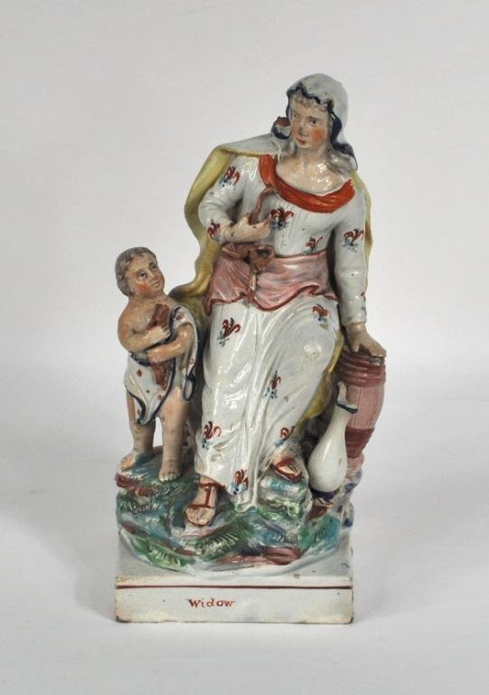 Fine Early Staffordshire Allegorical Figural Group: A fine early Staffordshire allegorical figural group, depicting the Old Testament widow of Zarephath with her son, oil jars, and flour barrel. The square base titled and bearing the impressed mark for