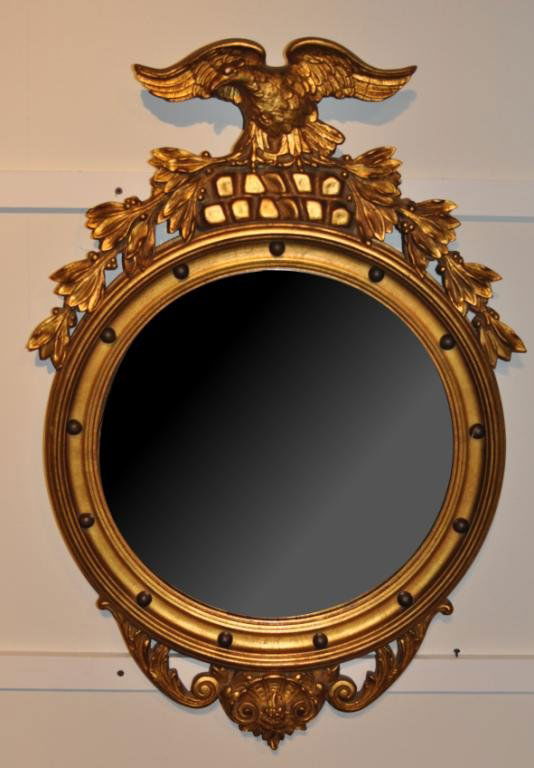 Classical Style Giltwood Convex Mirror: Classical style giltwood convex mirror, with eagle and laurel branch crest. 34 3/4" high, 22" wide.
