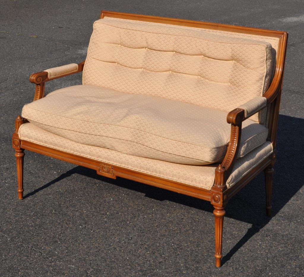 Louis XVI Style Small Settee: Louis XVI style small settee, with molded upholstered back and carved arms on fluted tapering legs. 36" high, 46" wide, 25" deep.