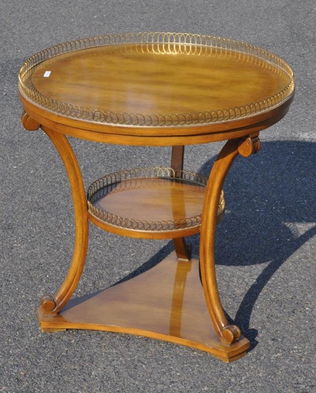 Neoclassical Style Mahogany Gueridon: Neoclassical style mahogany gueridon, with brass gallery and lower shelf on a tripartite base. 27 1/2" high, 27" diameter.