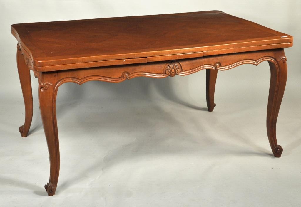 French Provincial Style Drawleaf Dining Table: French provincial style drawleaf walnut dining table, with parquetry top and two draw leaves. 29 1/2" high, 62" wide, 41 1/2" deep; open: 29 1/2" high, 108 1/2" wide, 41 1/2" deep