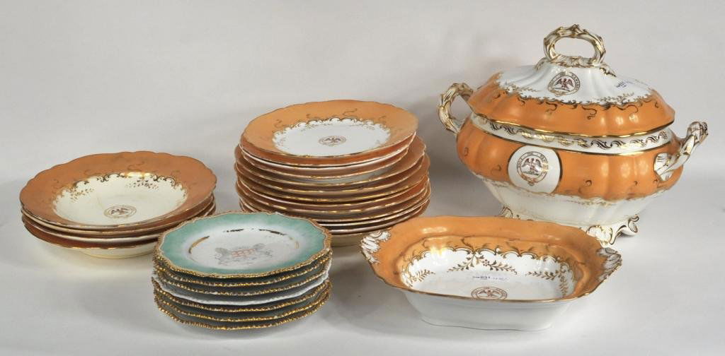 Group of 25 Assorted English Bone China Tablewares: Group of 25 assorted English bone china table wares, comprising pale orange and white plates, shallow bowls, serving dish, and covered tureen, all with crest and motto, together with six Worcester pla