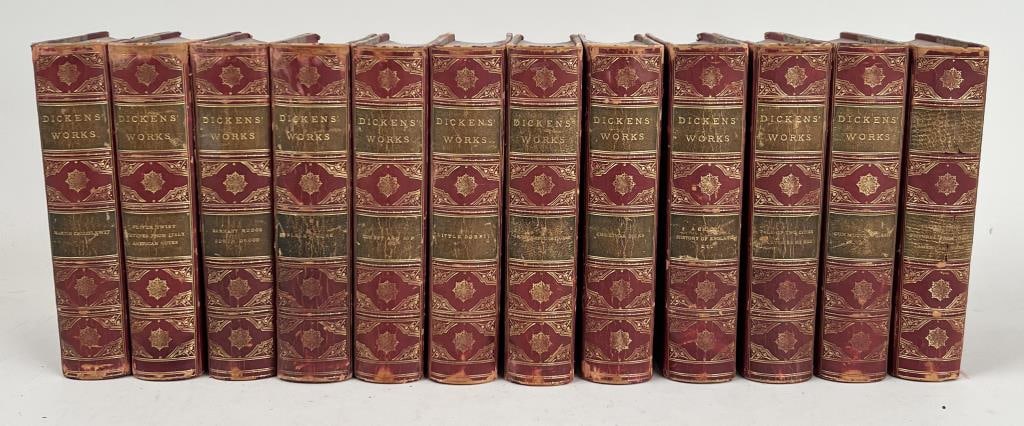 The Works Of Charles Dickens, 12 Vol.: John Wurtele Lovell, New York, nd. With full page illustrations and bound in 3/4 leather with gilt spines and marbled boards. 7 1/2" high, 5" wide. Some chipping, wear and damage to spines as found.