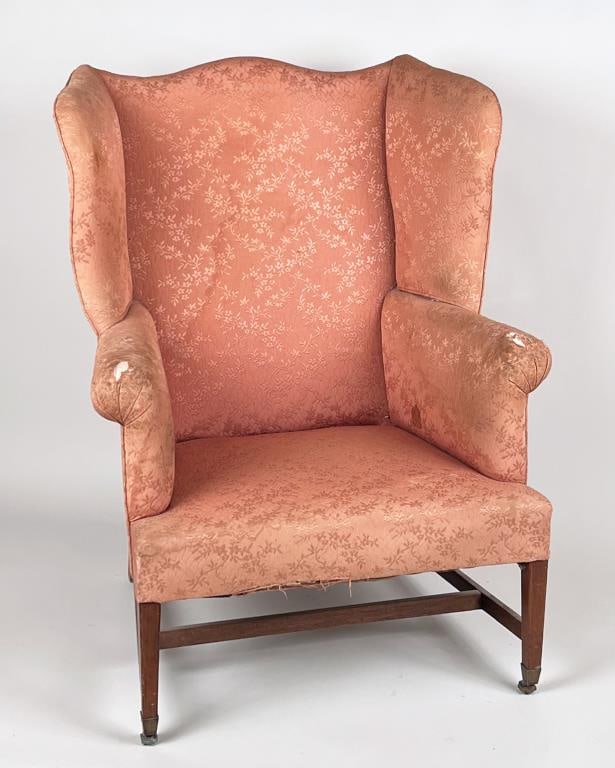 New England Hepplewhite Inlaid Mahogany Wing Chair: with serpentine crest and wings, rolled arms with cushioned seat, square tapering legs with line inlay and brass cup casters. 42" high, 30 3/4" wide, 24 1/2" deep. As is condition, needs reupholsterin