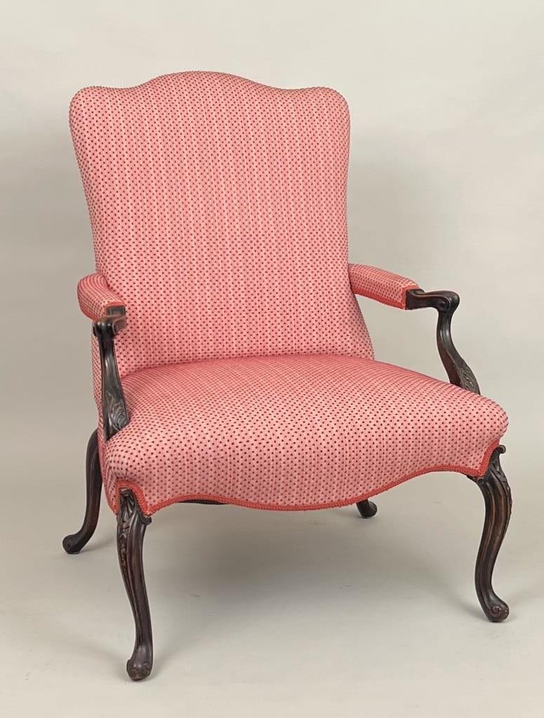 Louis XVI Carved Walnut Fauteil: with shaped back, carved arms and leaf carved cabriole legs. 19th century. 40 1/2" high, 30 1/2" wide, 28" deep. Some minor scratches.