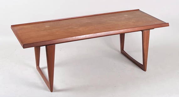 Danish Modern Walnut Coffee Table: attributed to Peter Lovig Nielsen; appears to be a faint stamp, possibly maker or seller, Danish Furniture control tag. 19" high, 58 1/2" wide, 22" deep.