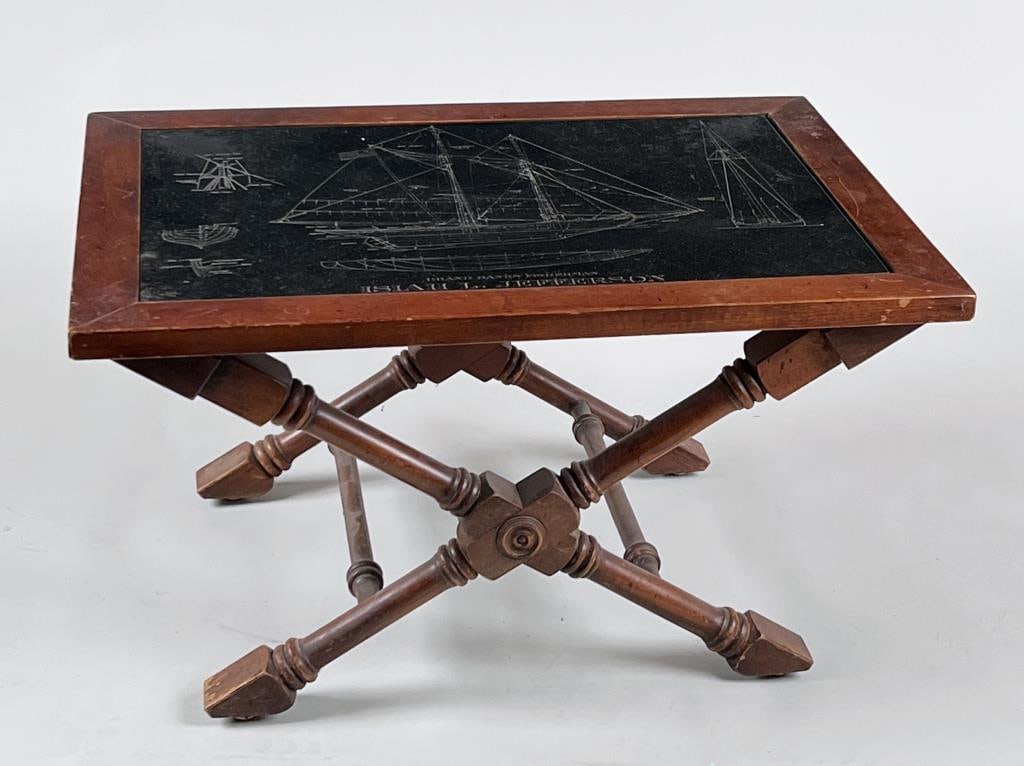 Jefferson Ship Plans On Slate, As Table: with the slate mounted on a turned scissor form "X" based stand. 15 5/8" high, 28 1/4" wide, 20 1/4" deep. Scratches, age and use wear.