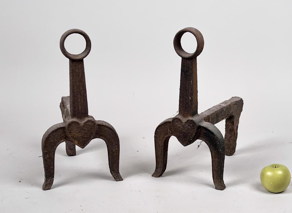 Pair Antique Heart Motif Cast Iron Andirons: 16 1/2" high, 8" wide, 14 1/2" deep. Oxidation, age and use wear.