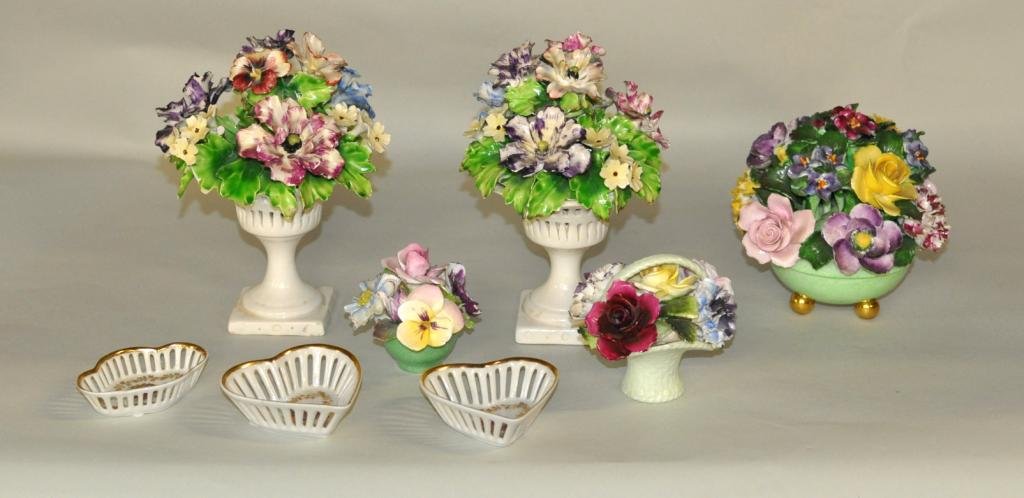 Eight Vintage Porcelain and Bone China Items: Eight vintage porcelain and bone china items, including arrangements of flowers together with three small Bavarian reticulated dishes. Largest: 8" high, 6" wide, 6" deep; smallest: 3/4" high, 3 1/4" w