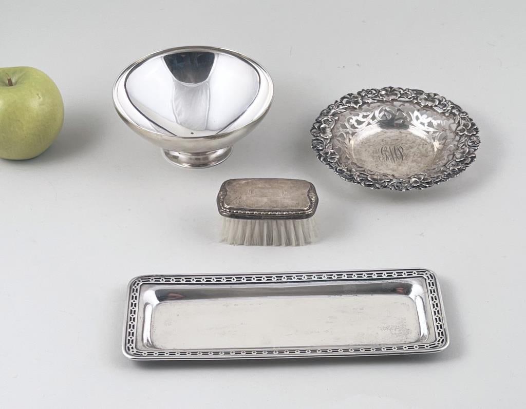 Four Sterling Table Accessories: comprising a vanity brush, Alvin pierced dish, Tiffany & Co bowl and Black Starr & Frost rectangular tray. Bowl: 2.25" high, 5 1/4" diameter. Weighable silver: 16.045 OZT. Age and use wear, light oxid