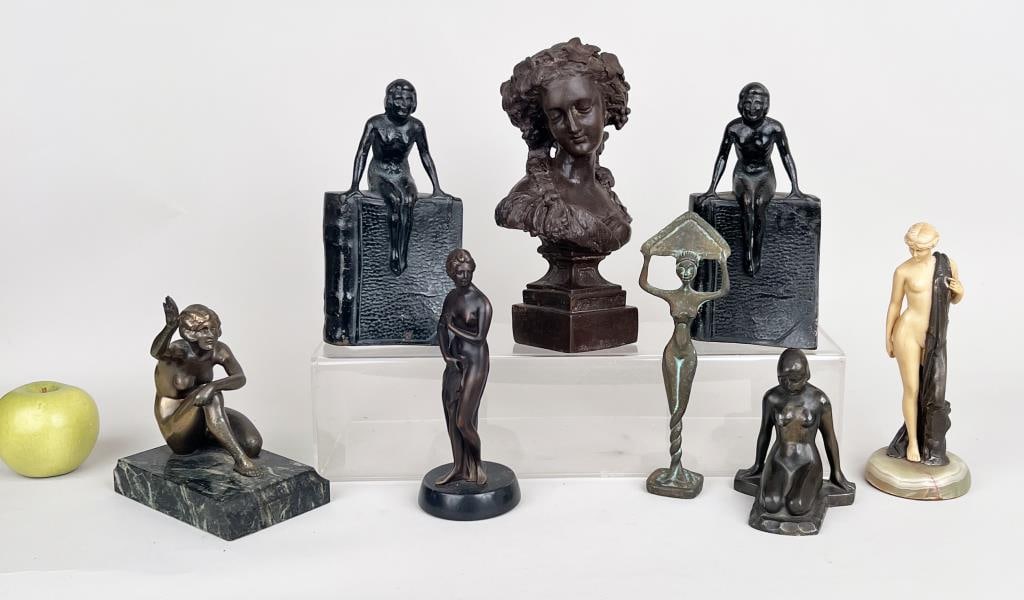 Group Eight Varied Metal Female Nude Figurines: comprising three bronze figures, pair of cast iron bookends and three spelter women. Largest: 9 1/2" high, 5 1/2" wide, 3" deep. Light wear, oxidation, spelter and resin woman with damaged foot.