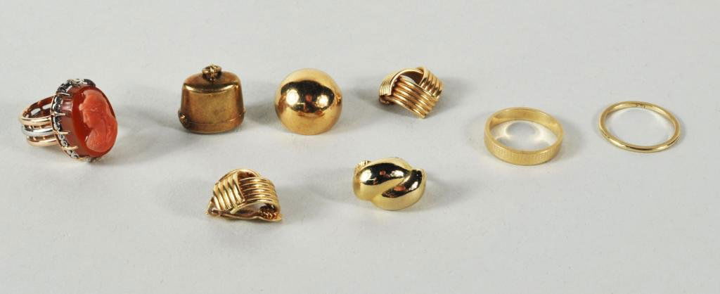 Group of 14K Gold Jewelry: Group of 14K gold jewelry comprising two wedding bands(sizes 6 1/4, 6 1/2), one charm, one ring with cameo (size 4 1/2) and bits and pieces of gold earrings. Total weight including stones 19.3 dwt. 8