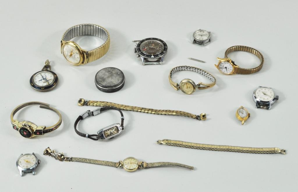 Group 17 Watches, Bands & Watch Parts: Group of 17 watches, bands and watch parts, 20th century, including: a Croton men's watch, and others. Items as is. 1" high, 1/2" wide, 1 1/4" high, 2 1/2" diameter