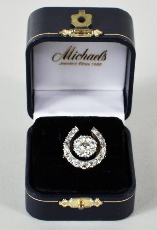Ladies 14K Gold & Diamond Horseshoe Ring: Ladies 14K gold and diamond horseshoe cluster ring, size 6, containing 26 old European cut and transitional cut diamonds approximately 1.85 cts. Larger stone is 15-18 pts, S1-1 or 2., J-K color. Total