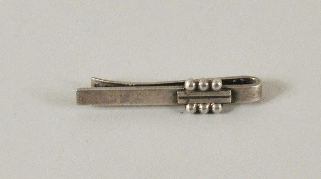 Georg Jensen Sterling Silver Tie Bar: Georg Jensen sterling silver tie bar, mounted with a section of a central incised bar flanked by three balls on either side. Hallmarked, 925S Denmark and A61. Approx weight 9.6 grams, 2" long