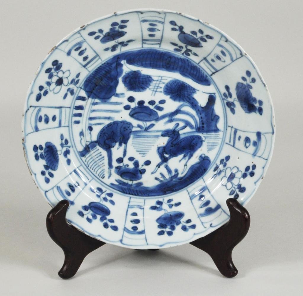 Chinese Kraak Porcelain Blue & White Plate: Chinese Kraak porcelain blue and white plate, circa 1600-1620, Wan U period, Ming Dynasty, depicting two deer in a landscape. Glaze chips, losses to rim. 1 1/2" high, 8 1/4" diameter