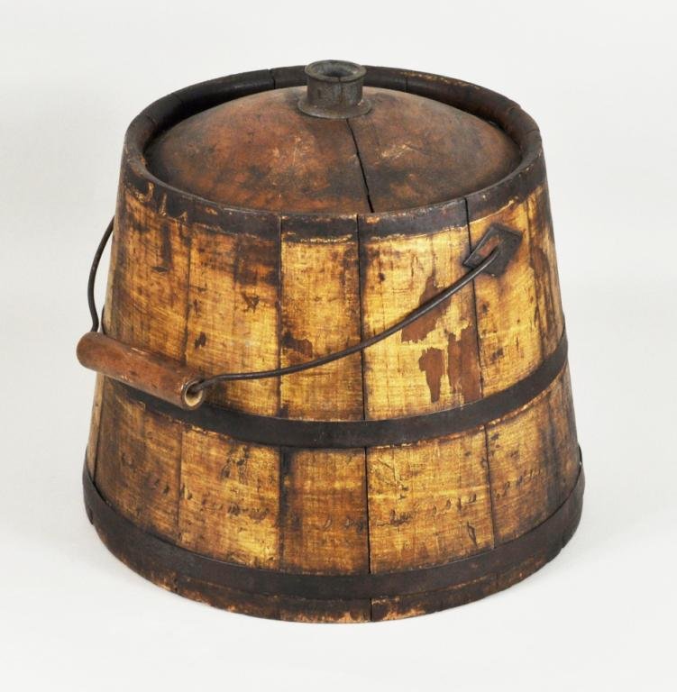 Yellow Painted Shaker Tar Bucket: Yellow painted Shaker tar bucket with domed top and diamond escutcheons, with remnants of red painted pine tree decoration on bottom. 11 1/2" high, 12" diameter.