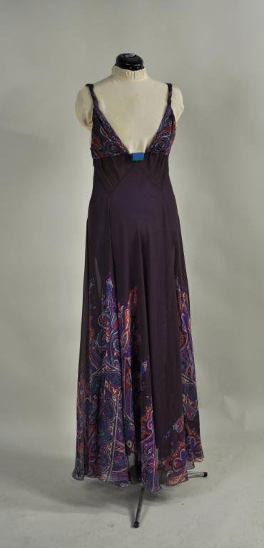 Labeled Etro Silk Chiffon Evening Dress: Labeled Etro silk chiffon full bias cut evening dress, in dark plum with a paisley printed border, the neck with possible lucite tri-colored ornament, size 42.