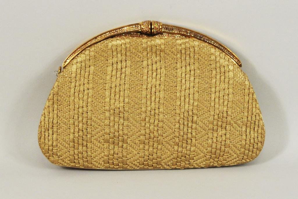 Vintage Gold Brocade Judith Leiber Handbag: Vintage gold brocade Judith Leiber handbag, coin purse in interior, lacking chain, some wear, lacking store label, clasp missing one rhinestone. 9 1/2" high, 6 1/2" wide
