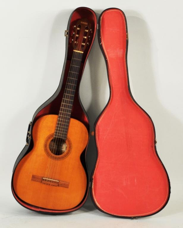 Yamaha Acoustic Guitar: Yamaha acoustic guitar, 20th C, label in interior: Yamaha No. 120 Nippon Gaki, in case. 38 3/4" high, 14 1/2" wide. Condition: use wear, finish wear