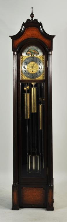 Herschede & Co. Musical Grandmother Clock: Herschede & Co musical grandfather clock, 20th C., havigan arched top with bird's eye maple veneer over silver and gilt pierce carved dial, glass door flanked by fluted columns. 77 1/2" high, 16 1/2" 