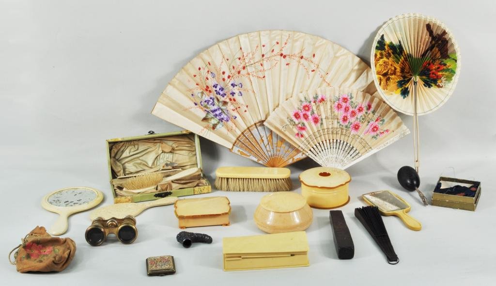 Group Woman's Dresser Articles: Group of woman's dresser articles and other items, c. 1920, including a celluloid dresser set, a large hand painted fan, a cased set of two shaving razors and other items. Largest: 14" high, 24" wide;