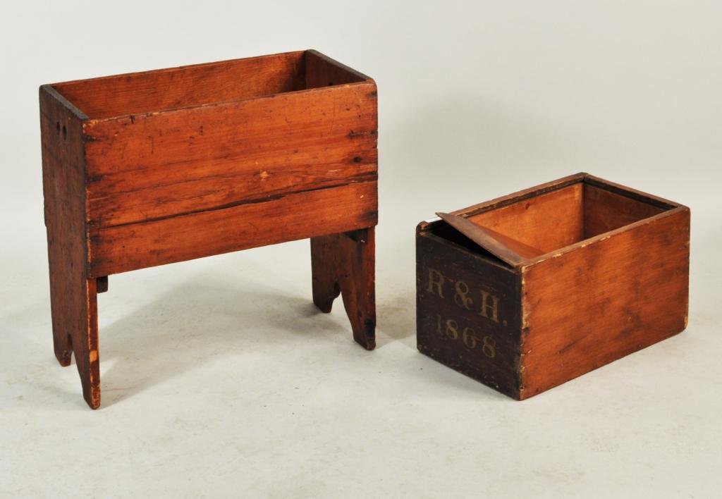 Two American Primitive Wooden Items, 19th C.: Two American primitive wooden items, 19th C., comprising a primitive dovetailed box with sliding lid and a bin with bootjack ends. Large: 22" high, 24" wide, 12 1/2" deep; small: 10 1/2" high, 12" wid