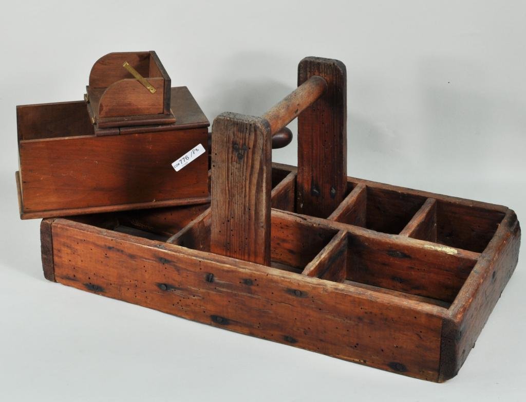 Early Wooden Ballot Box, Primitive Tray: Two wooden items, 19th/20th C., comprising a vintage wooden ballot box and a carpenter's caddy. Largest: 10" high, 21" long; smallest: 4 1/2" high, 14 1/2" long. Condition: finish use wear, loss, cadd