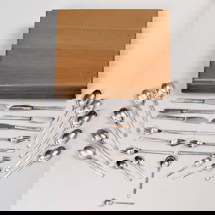 Wilkens German .800 Silver Partial Dessert Service: in "Cantone" modern design, comprising twenty-six pieces: six silver handled dinner knives, ten dinner spoons, six forks and four assorted smaller spoons, one non-matching. Weighable silver: 31.40