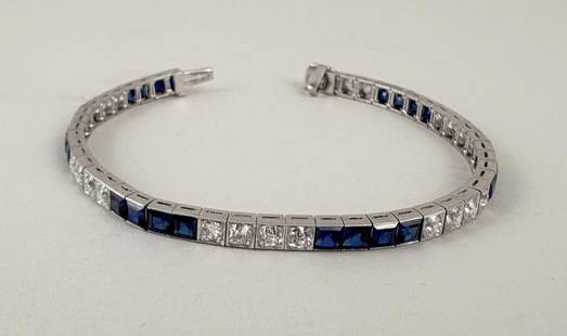 Art Deco Platinum, Diamond & Sapphire Bracelet: synthetic sapphires. Box style catch with fold under safety; forty eight total links: six sets of four links channel set with 3.5 mm synthetic sapphires; six other sets of four links bead set with tot
