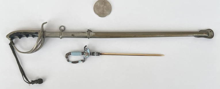 14K Gold, Enamel American Miniature Sword: together with with sabre style letter opener in sheath. Gold sword with ornate grip with eagle head, American eagle engraved insignia, tested 14K. Gross weight of smallest: 4.1 DWT. Largest: 9 1/2"