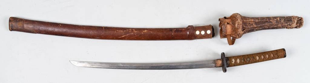 Japanese WWII Katana Sword: in leather case with GI inscription and "Koriyama, Japan"; iron Tsuba with wrapped ray skin grip, blade signed. Overall: 36" long, 2 3/4" wide, 2 3/4" deep. Exposed blade: 21". Oxidation, leather wear