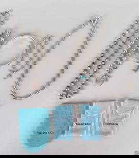 Group Tiffany & Co Jewelry: comprising ball necklace, ball and enamel bracelet, ball bracelet, lock cuff bracelet and Aztec Zig-Zag necklace (five pieces total). Necklace: 16" long. Weight: 4.475 OZT. Oxidation, use wear. *No cr